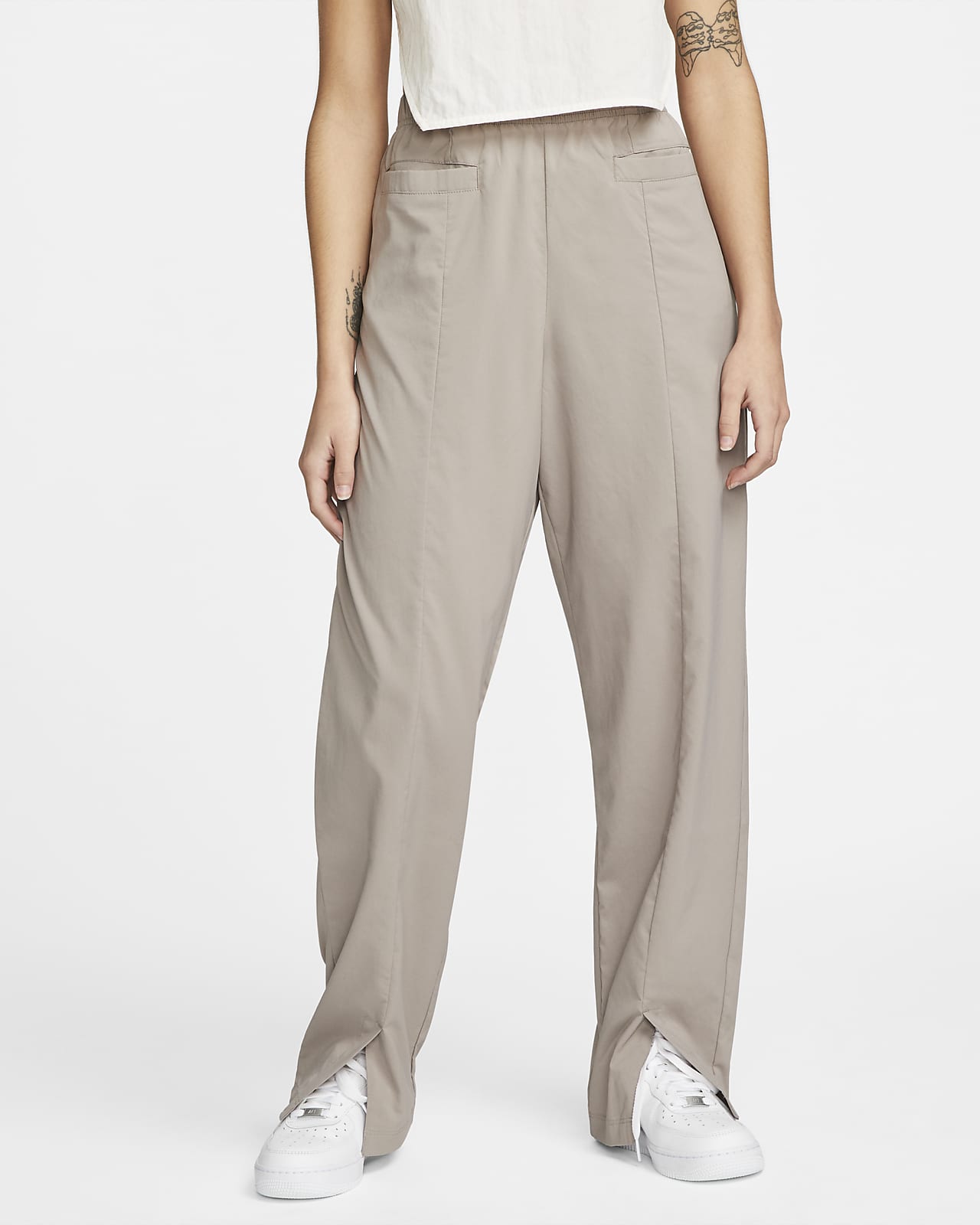 Pantalon tissé taille haute Nike Sportswear Dri-FIT Tech Pack pour Femme