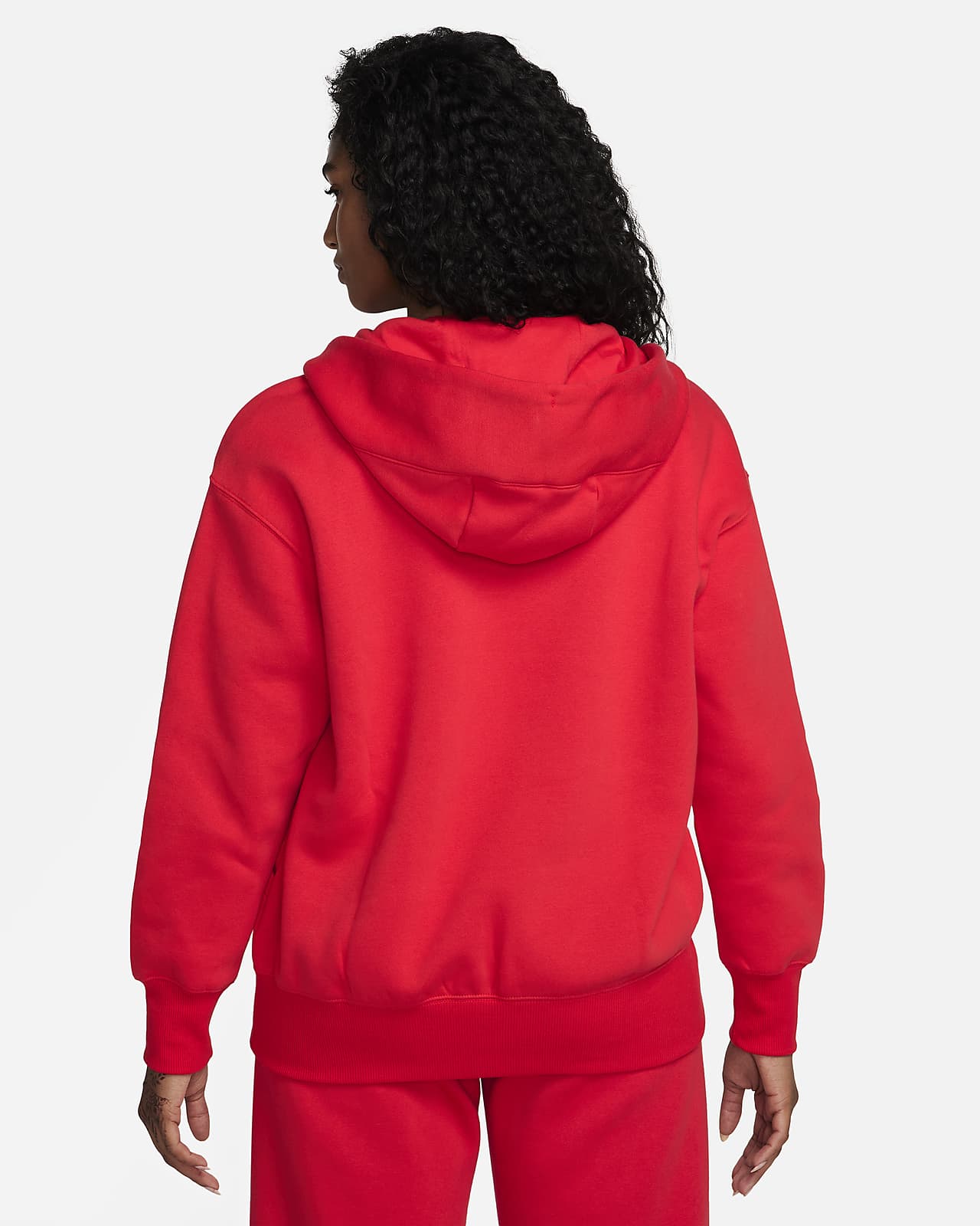 Mujer En Sudadera Roja Con Capucha De Nike Sosteniendo Piña · Foto de stock  gratuita