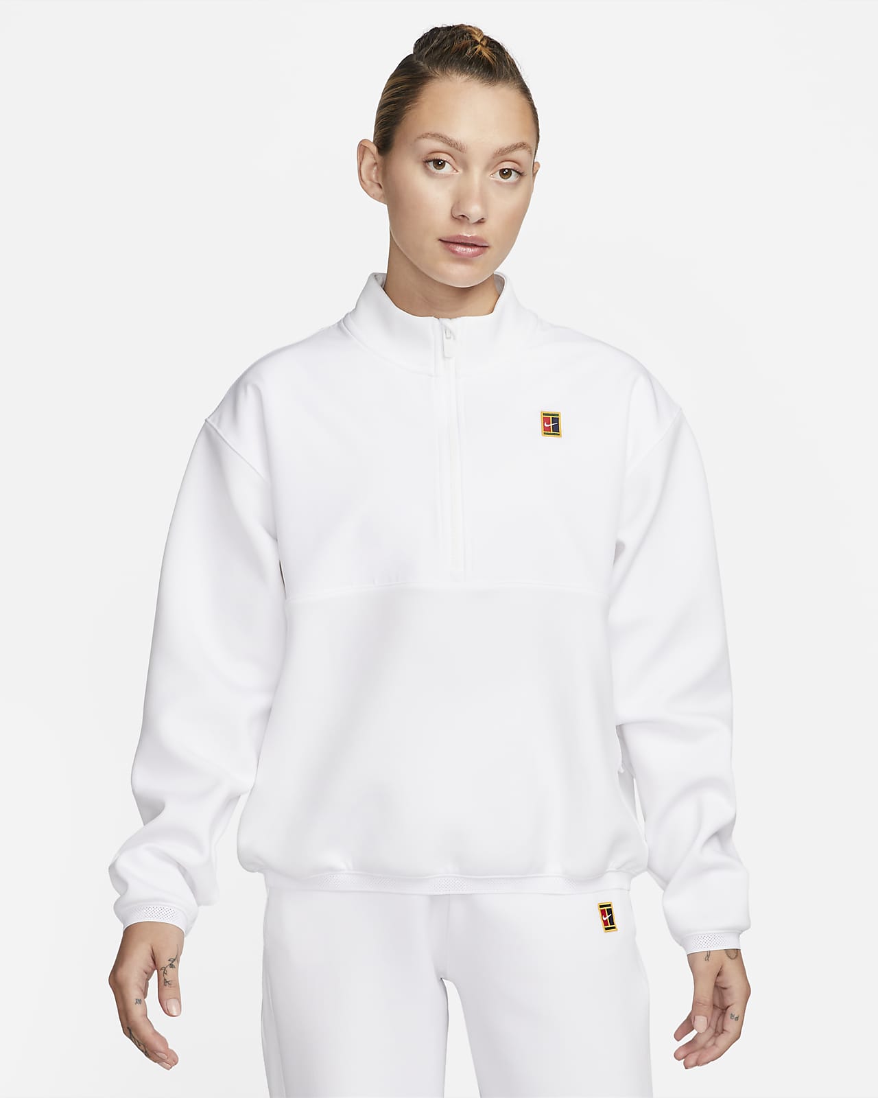 NikeCourt Dri-FIT Heritage Camiseta de tenis con cremallera Mujer. Nike