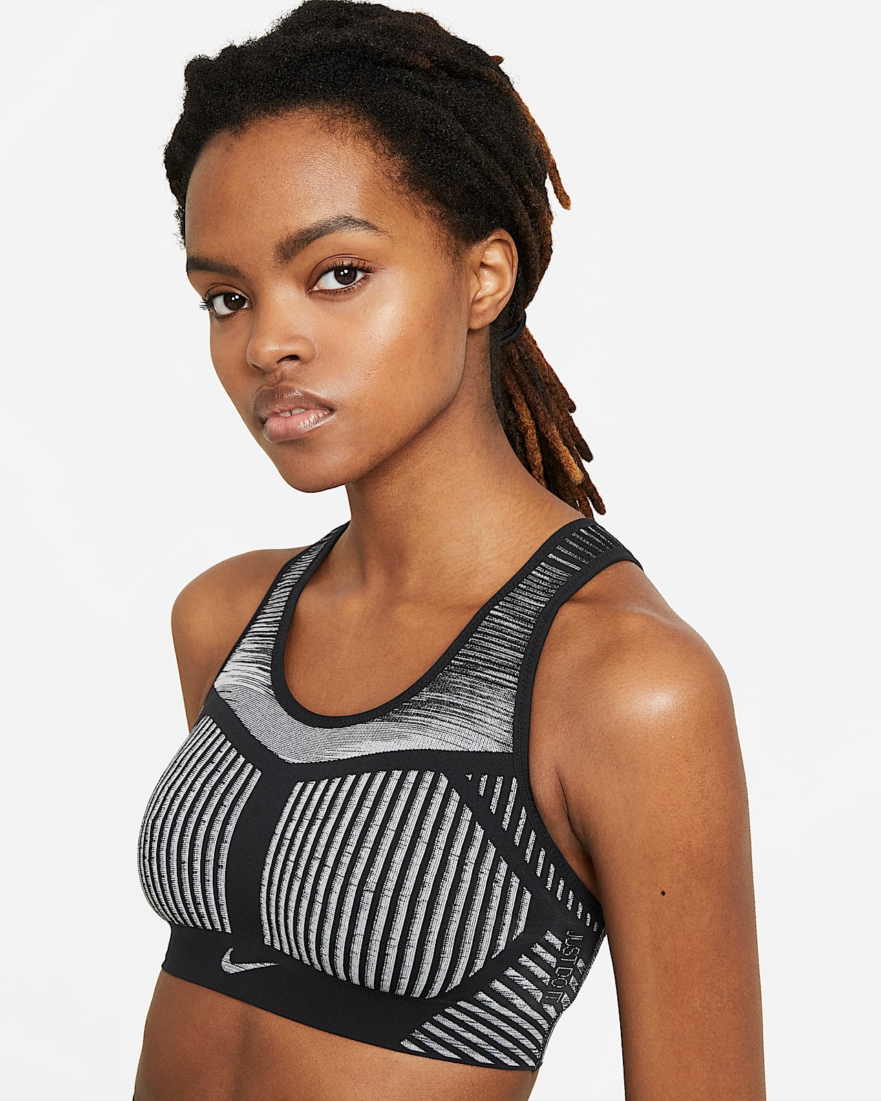 Nike FE/NOM Flyknit Sujetador deportivo de sujeción alta sin acolchado-  Mujer. Nike ES