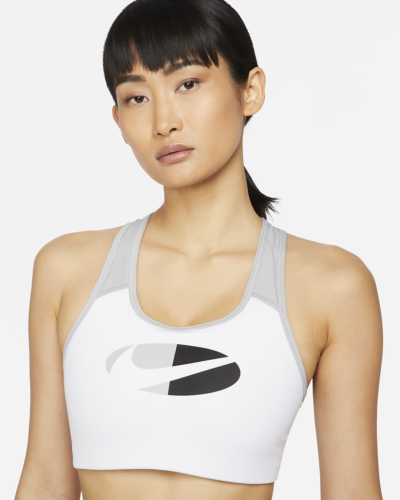 rille Staple spøgelse Nike Dri-FIT Swoosh-sports-bh med farveblokke og medium støtte og indlæg i  ét stykke til kvinder. Nike DK