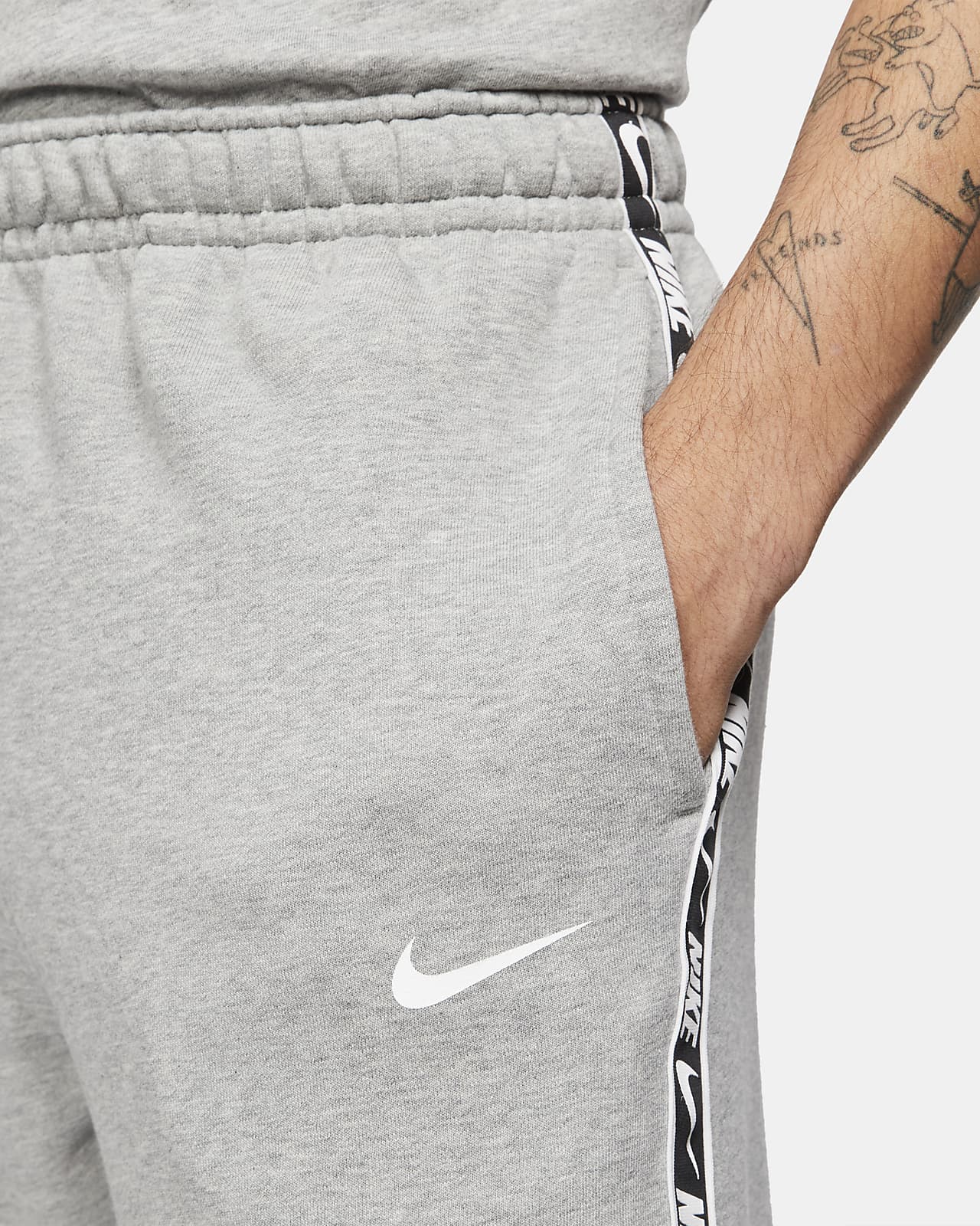 grey nike joggers with side pockets
