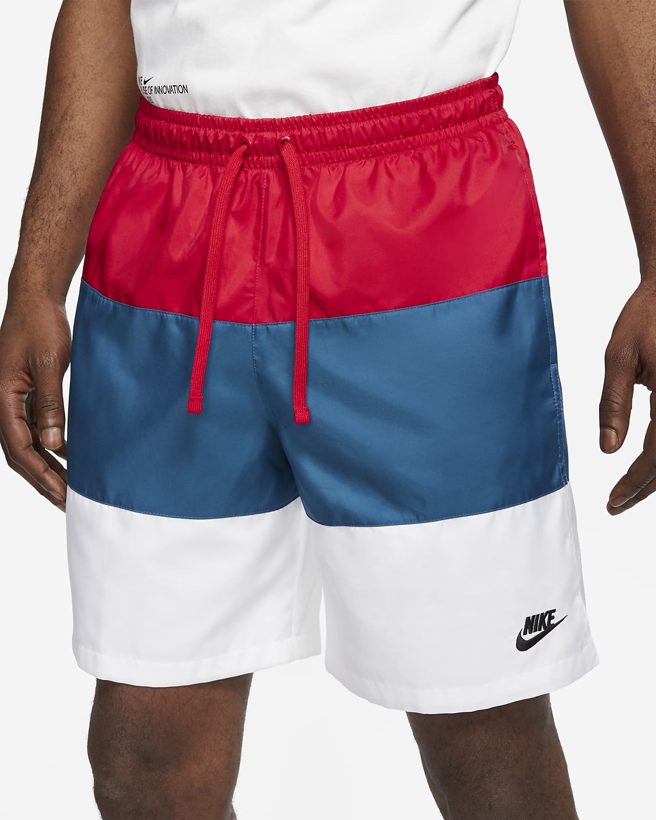 red nike woven shorts