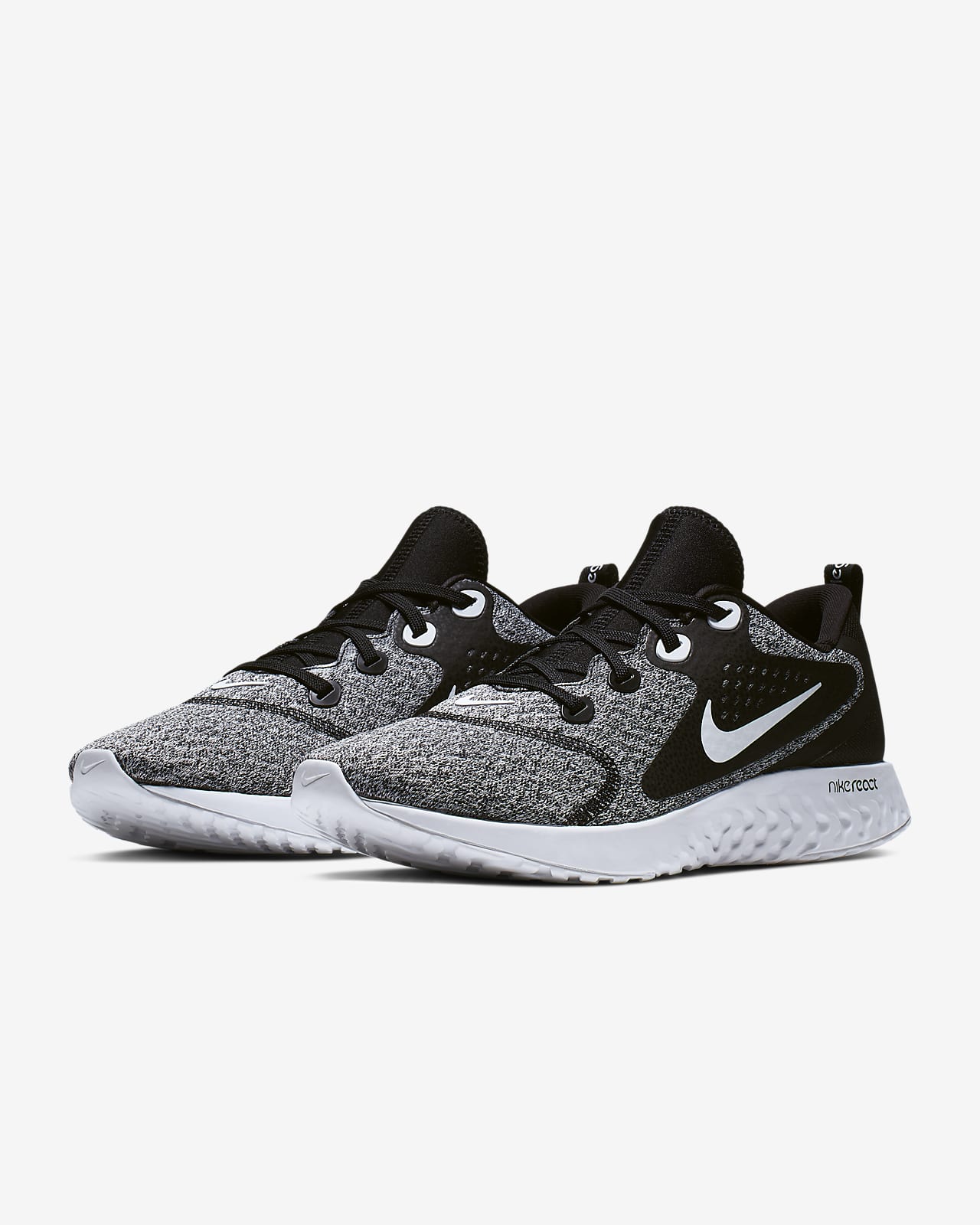 nike running legend react trainers in black and white