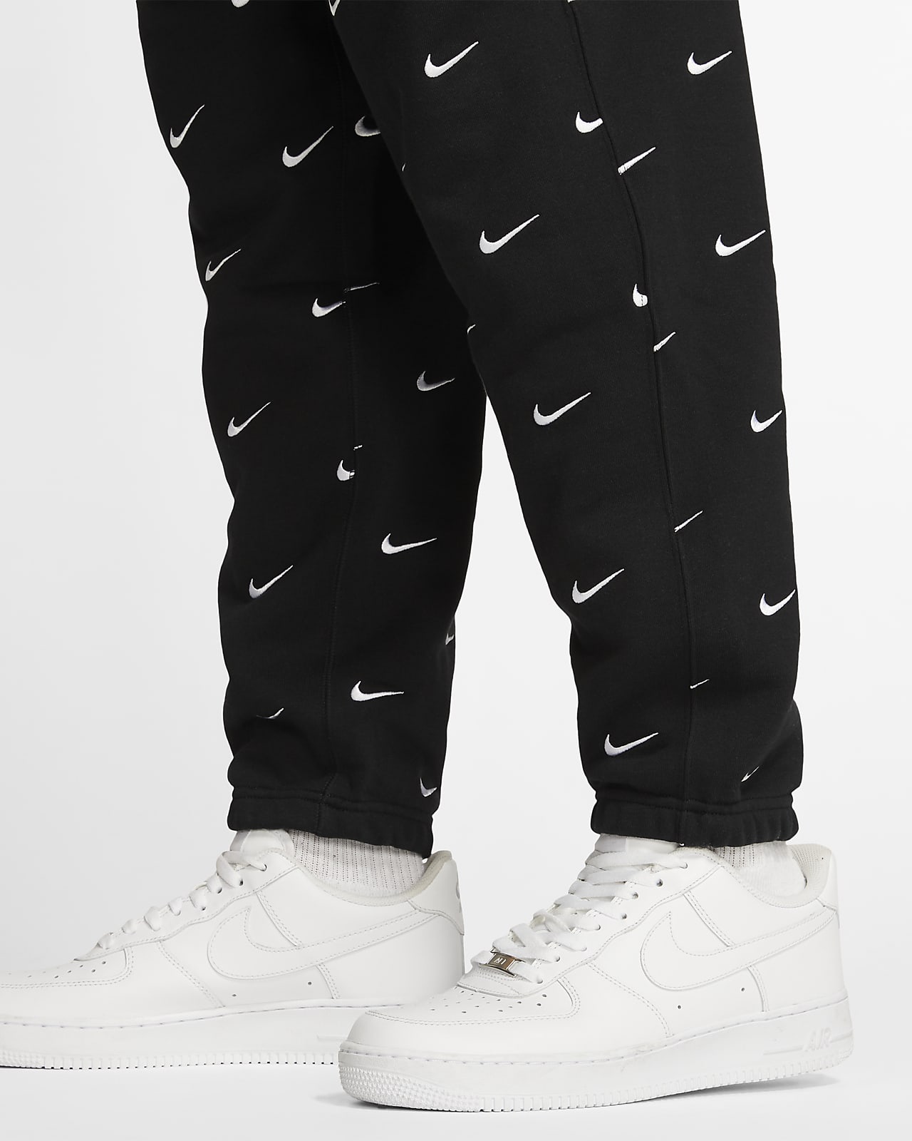 all over swoosh joggers