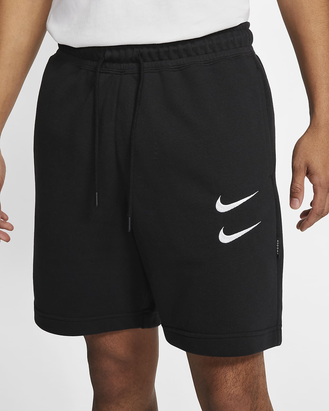 nike swoosh logo shorts in black