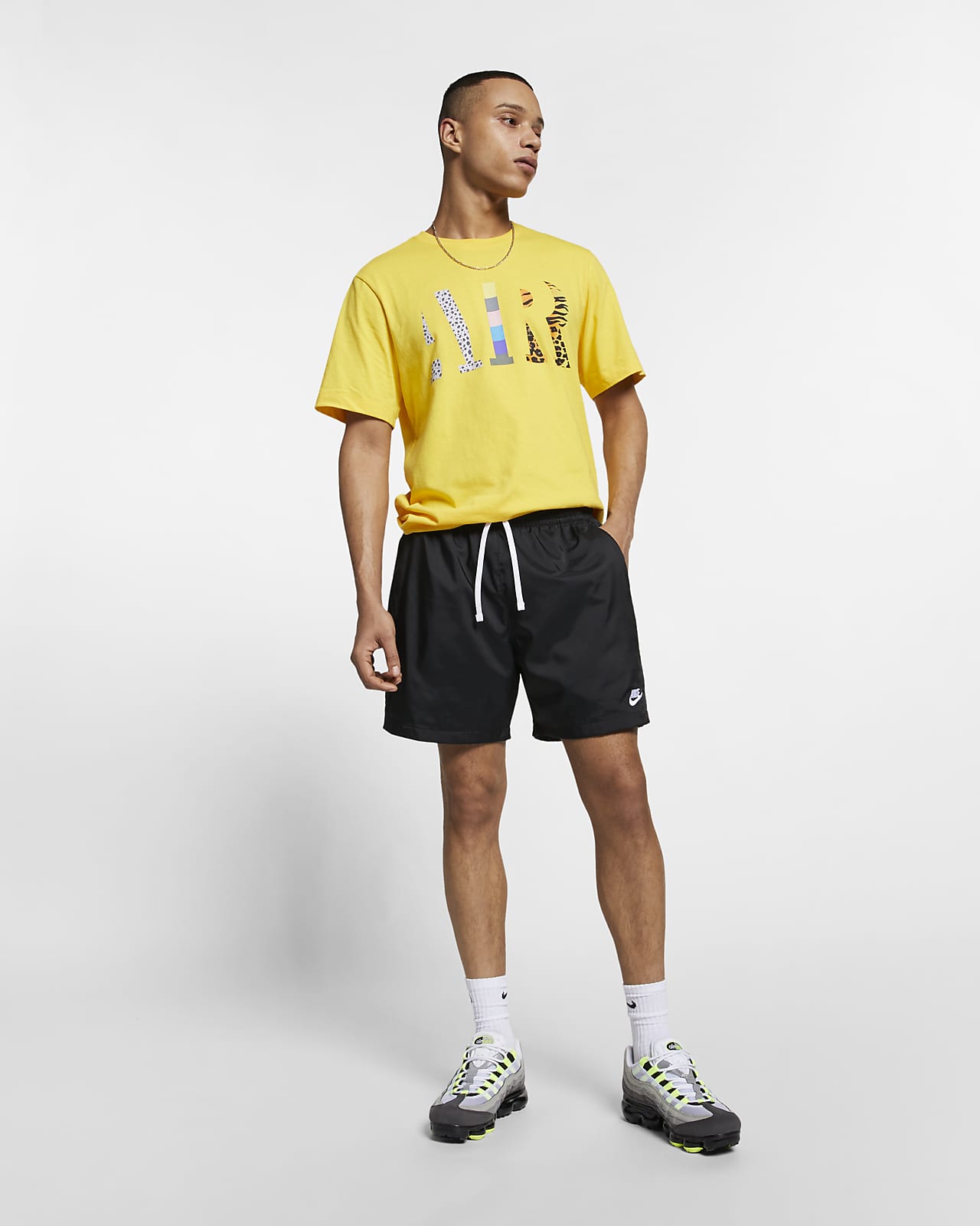 yellow nike woven shorts