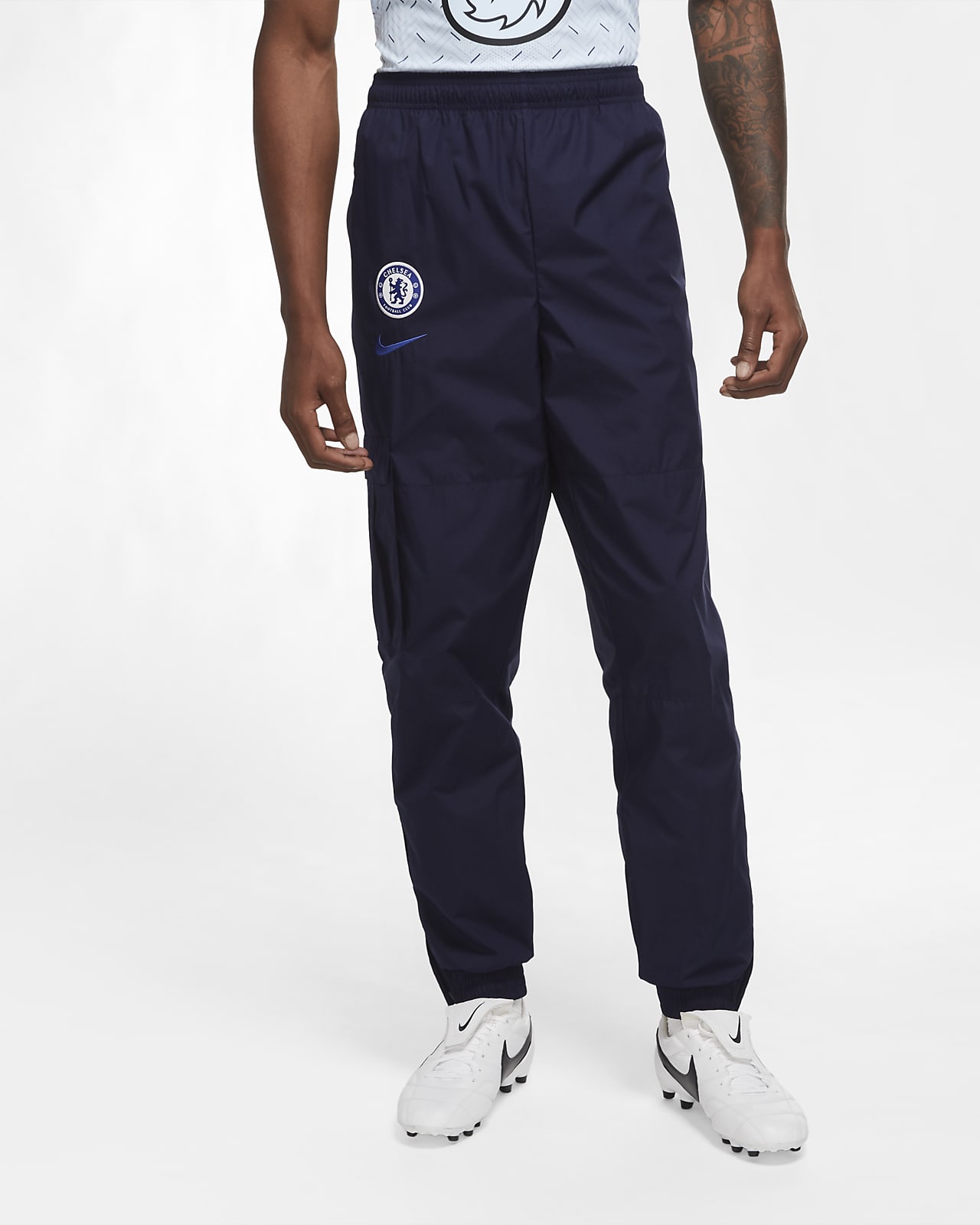 Chelsea F.C. Men's Woven Football Tracksuit Bottoms. Nike EG