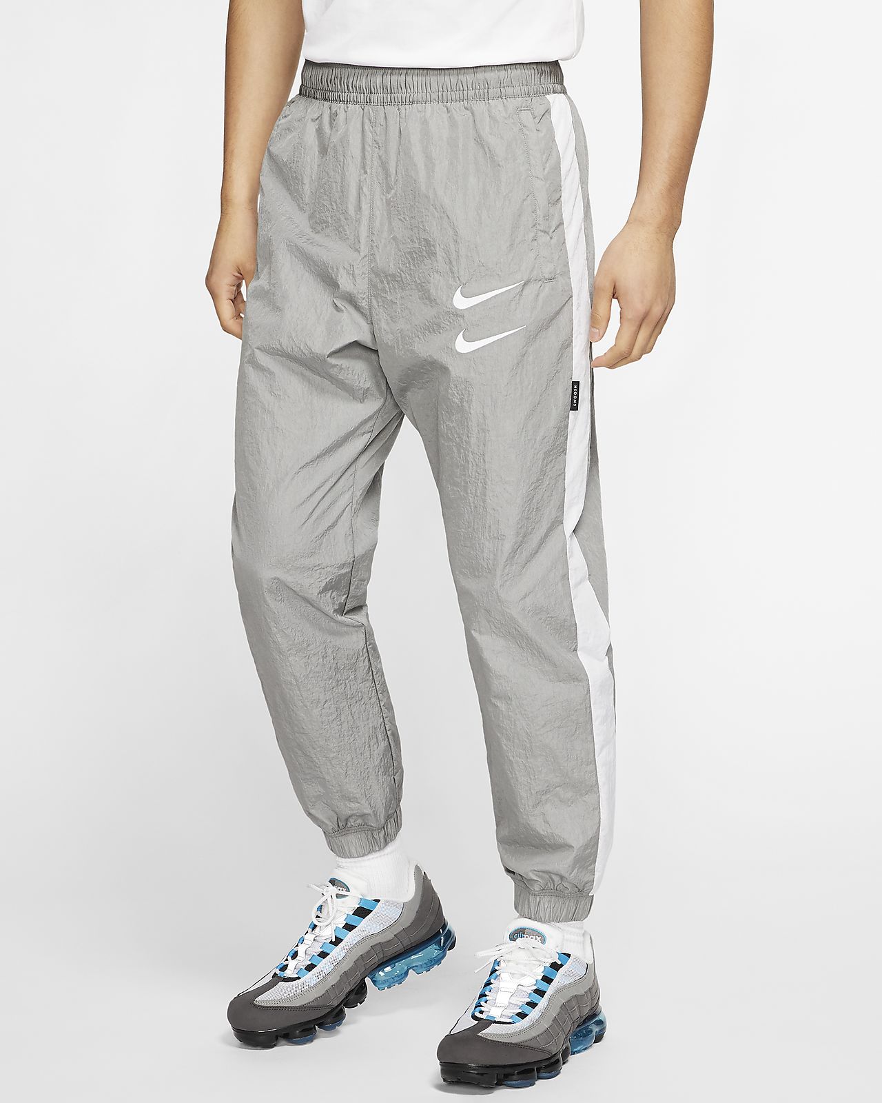 nike big swoosh woven pants