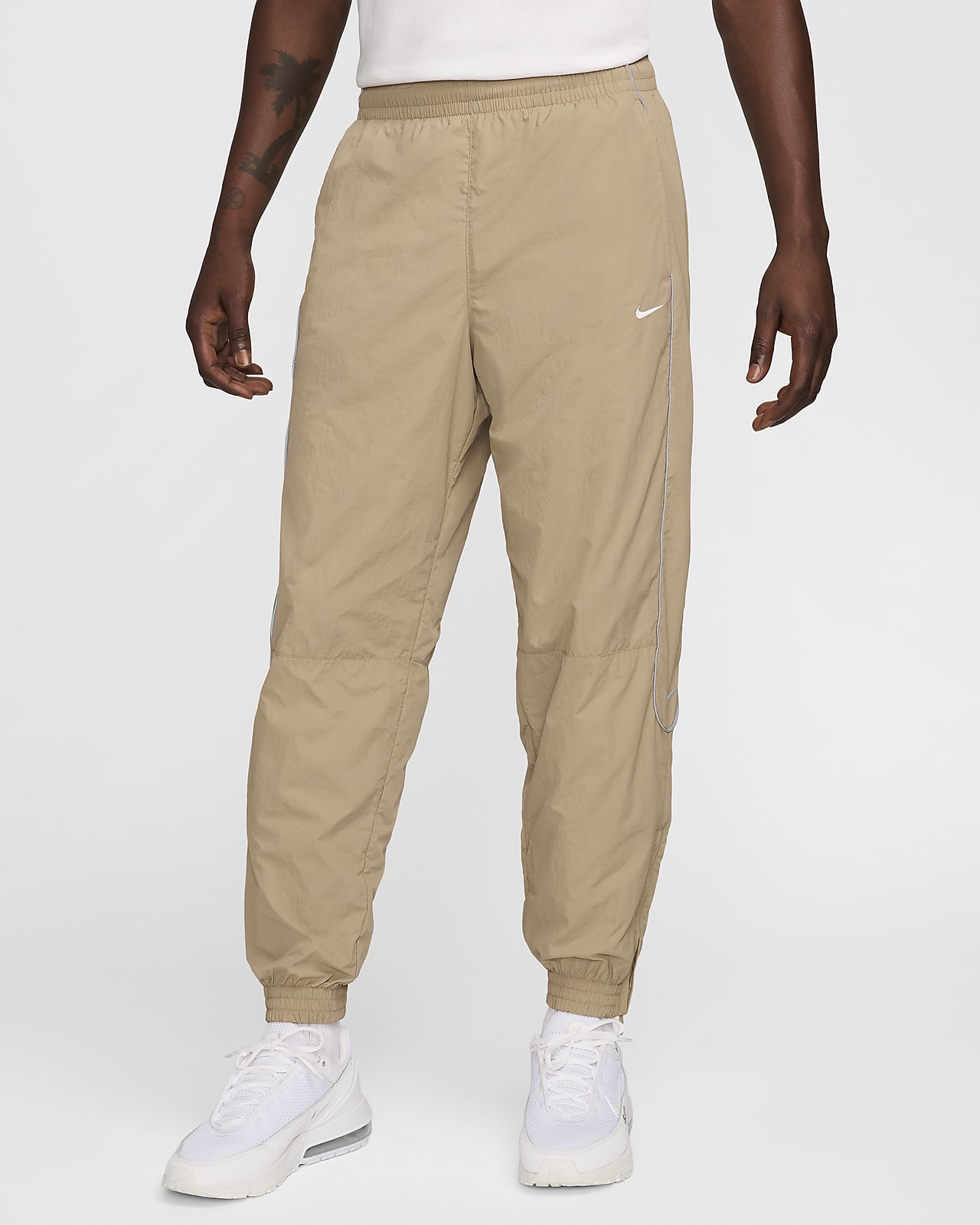 swoosh track pants