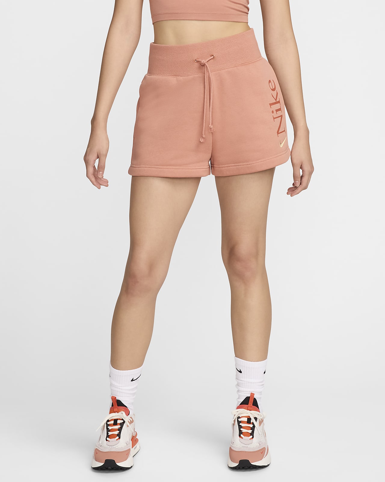 กางเกงขาสั้นเอวสูง 2 นิ้วทรงหลวมมีโลโก้ผู้หญิง Nike Sportswear Phoenix Fleece
