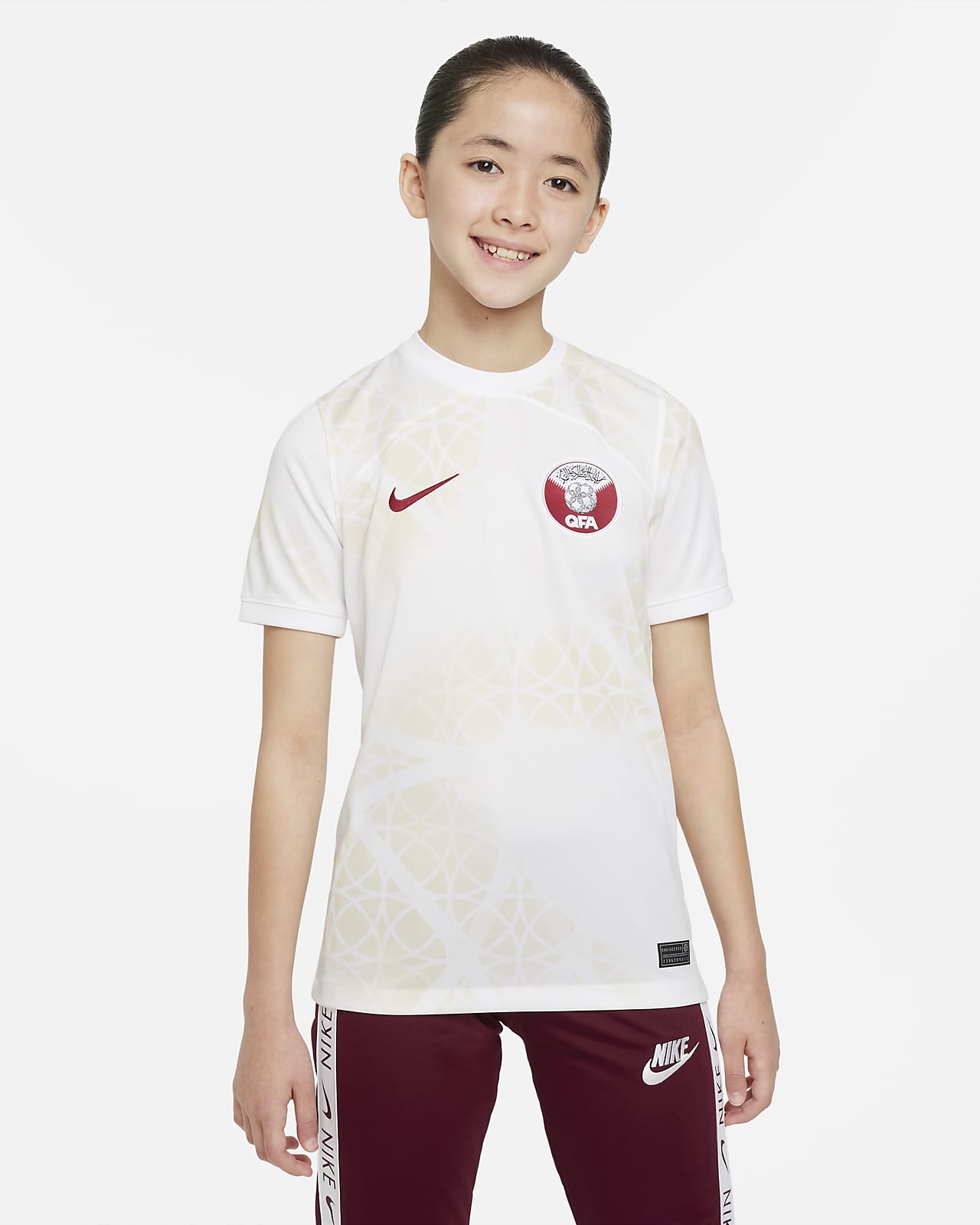 Qatar 2022/23 Stadium Away Older Kids' Nike Dri-FIT Football Shirt. Nike BG