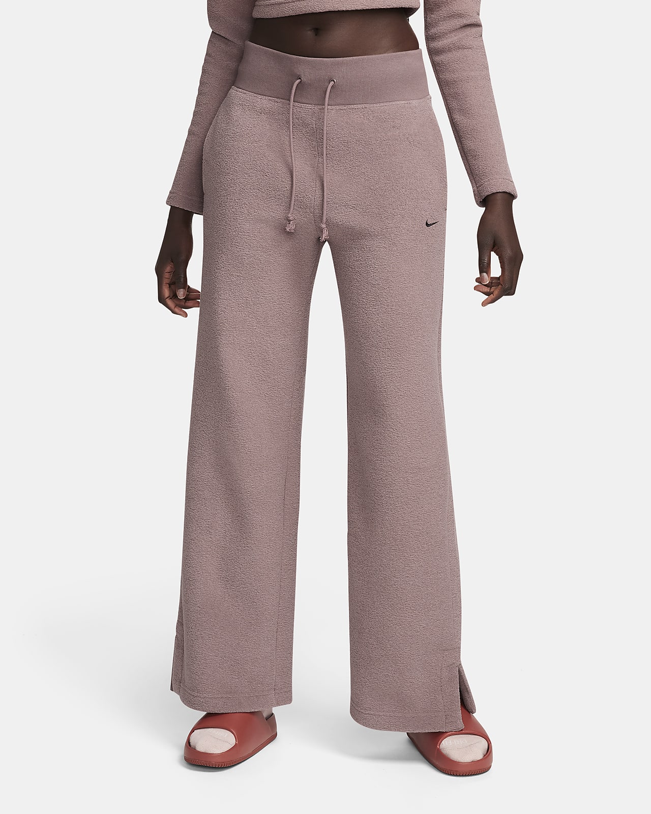 Damskie spodnie z wysokim stanem i szerokimi nogawkami z wygodnej dzianiny Nike Sportswear Phoenix Plush