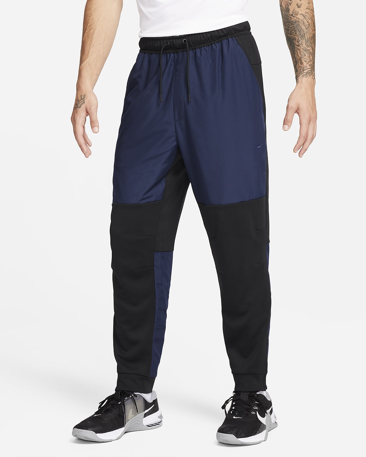 Pants versátiles con cierre en el puño repelentes al agua para hombre Nike Unlimited