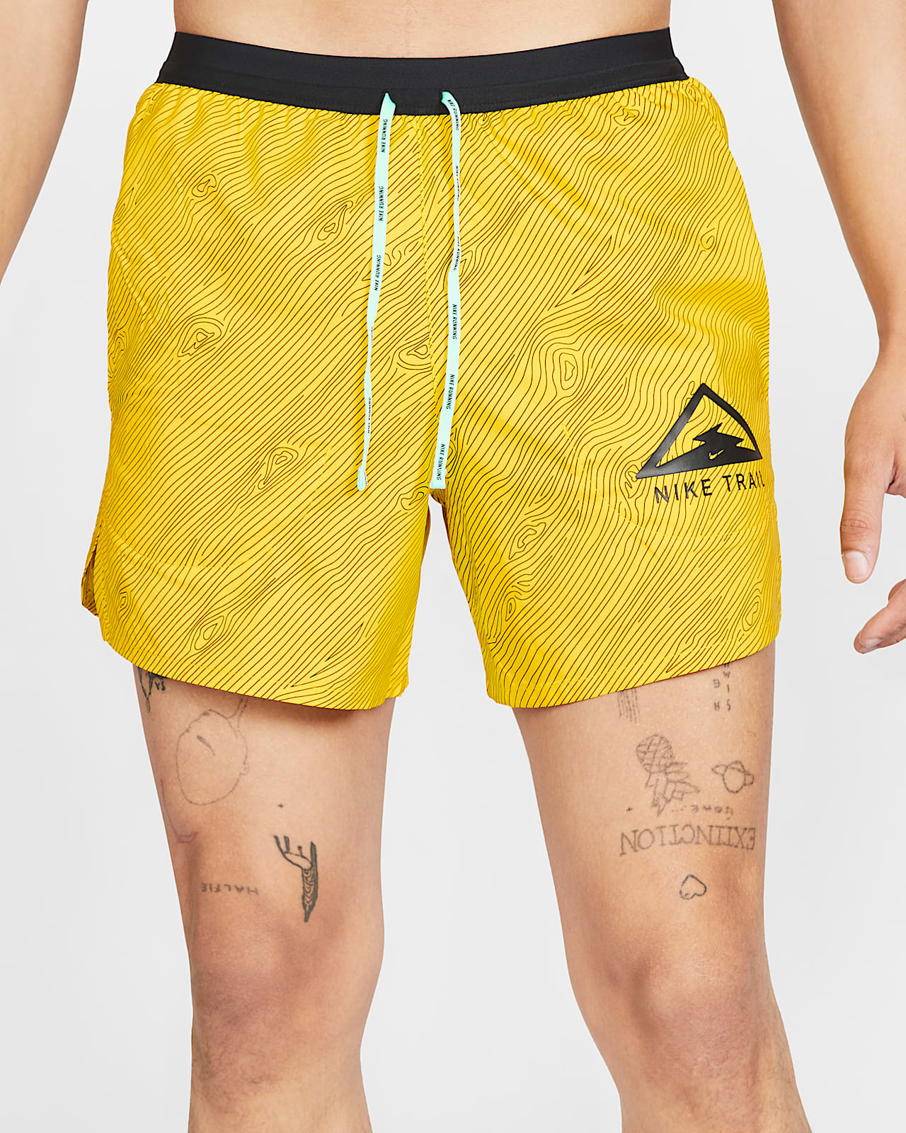 nike trail shorts yellow