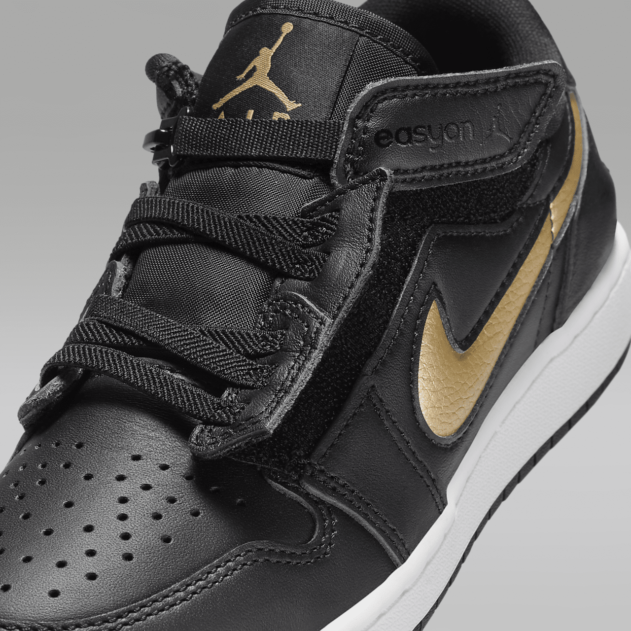 Nike Air Jordan 1 Low sneaker Zwart/Wit/Metallic Gold