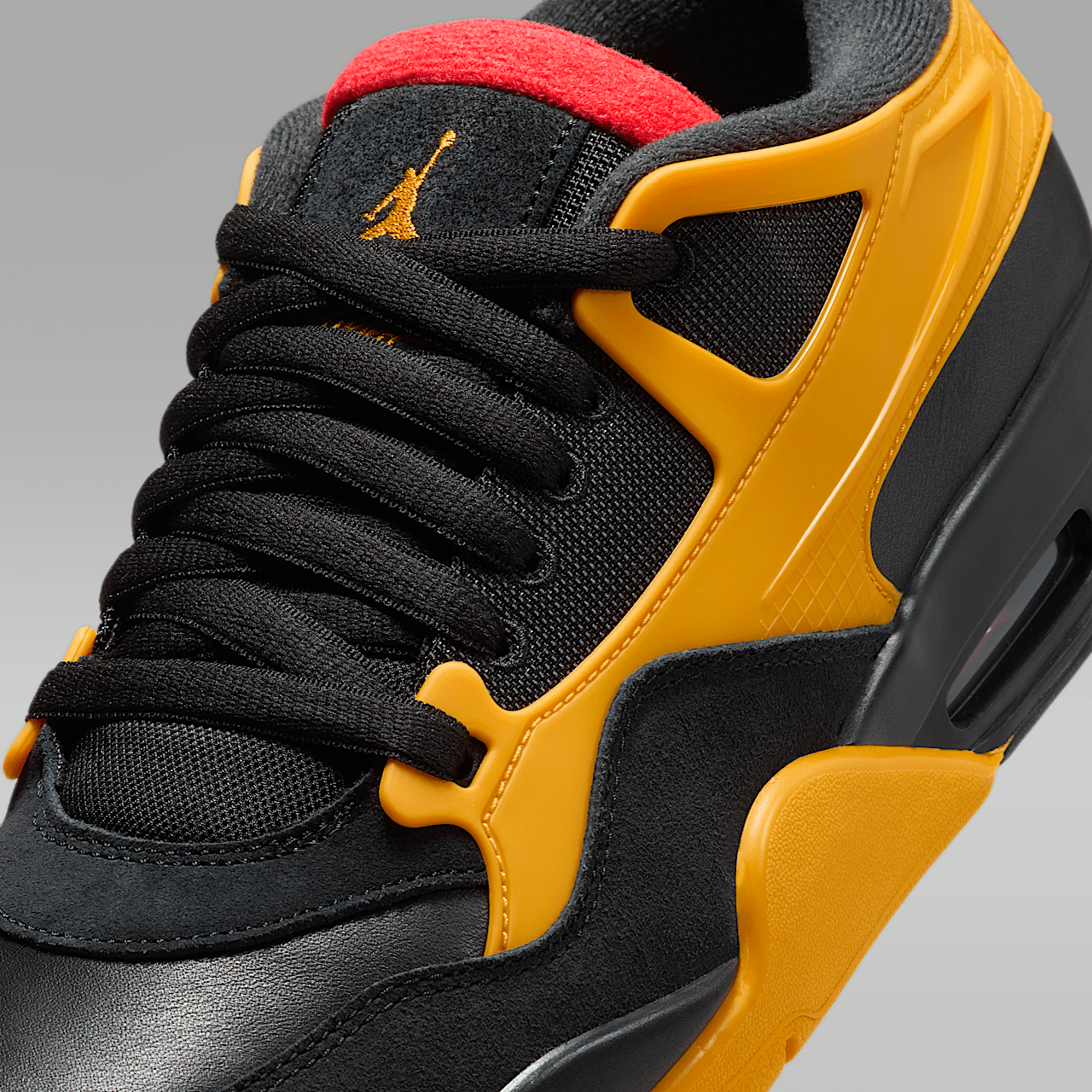 Nike Air Jordan 4 RM sneaker Zwart/Del Sol/Comet Red