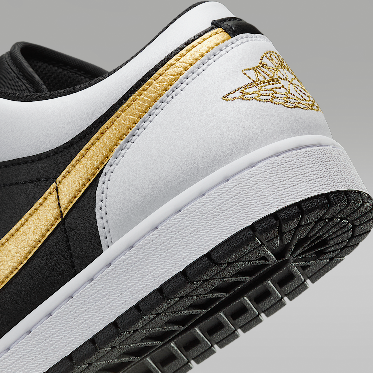 Nike Air Jordan 1 Low sneaker Wit/Zwart/Metallic Gold