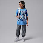 PlayeraAJ11 University Blue Retro GOAT para niños talla grande Jordan