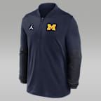 Playera universitaria marca Jordan Dri-FIT de medio cierre para hombre Michigan