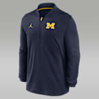 Playera universitaria marca Jordan Dri-FIT de medio cierre para hombre Michigan Sideline