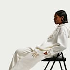 Pantaloni jogger oversize Nike Sportswear Phoenix Fleece a vita alta – Donna