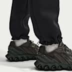 Pantaloni in fleece a blocchi di colore con orlo aperto Nike Tech – Uomo
