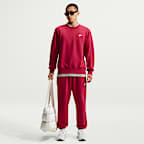 Pants de tejido Fleece cepillado con puños para hombre Nike Club