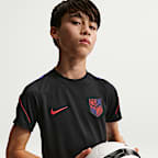 Playera de fútbol de manga corta Nike Dri-FIT para niños talla grande USMNT Strike