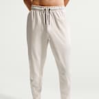 Mångsidiga byxor Nike Unlimited Dri-FIT med mudd med dragkedja för män