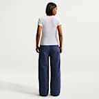 Pants de tiro medio con dobladillo abierto para mujer Nike Sportswear Everything Wovens