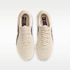 Tacos de fútbol para terrenos múltiples de corte low para niños grandes Nike United Jr. Tiempo Maestro Academy