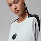 Paris Saint-Germain Strike Night Edition Jordan Dri-FIT knit voetbaltrainingstop met ronde hals voor dames