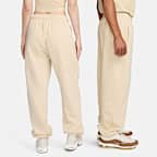 Pants de entrenamiento oversized de tiro medio para mujer Nike Sportswear Club Fleece