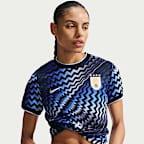 Playera de fútbol de manga corta Nike Dri-FIT para antes del partido para mujer Uruguay