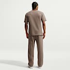 Pants de básquetbol Therma-FIT cepillados con dobladillo abierto para hombre Nike Standard Issue