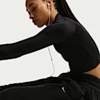 Joggers de tejido Fleece Therma-FIT de tiro medio para mujer Nike One