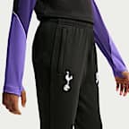 Dzianinowe spodnie piłkarskie dla dużych dzieci Nike Dri-FIT Tottenham Hotspur Strike (wersja trzecia)