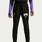 Dzianinowe spodnie piłkarskie dla dużych dzieci Nike Dri-FIT Tottenham Hotspur Strike (wersja trzecia)