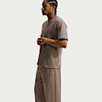 Pants de básquetbol Therma-FIT cepillados con dobladillo abierto para hombre Nike Standard Issue
