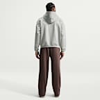 Pants de básquetbol Therma-FIT cepillados con dobladillo abierto para hombre Nike Standard Issue
