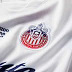 Jersey de futbol Nike Dri-FIT Replica del C.D. Guadalajara visitante 2026/27 Stadium para mujer