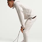 Mångsidiga byxor Nike Unlimited Dri-FIT med mudd med dragkedja för män