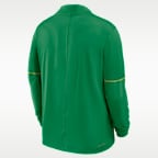 Playera universitaria Nike Dri-FIT de medio cierre para hombre Oregon Sideline