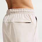 Mångsidiga byxor Nike Unlimited Dri-FIT med mudd med dragkedja för män