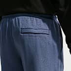 Pants de tejido Fleece con dobladillo abierto para hombre Nike Club