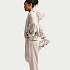 Joggers de tejido Fleece Therma-FIT de tiro medio para mujer Nike One