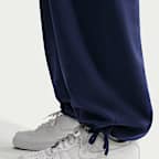 Nike Solo Swoosh Pantalón de tejido Fleece con dobladillo abierto - Hombre