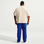Pants de tejido Fleece con dobladillo abierto para hombre Nike Club