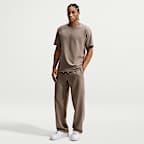 Pants de básquetbol Therma-FIT cepillados con dobladillo abierto para hombre Nike Standard Issue